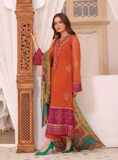 Orange Salwar Kameez Pakistani Eid Dress in Chiffon fabric is a traditional attire to wear on the big day. This beautiful Pakistani Dress is adorned with lavish embroideries and digital print, making it an epitome of beauty to have a head-turning appearance. Zainab Chottani, Salwar Kameez Pakistani, Eid Dress, Trouser Design, Beautiful Pakistani Dresses, Eid Dresses, Chiffon Dupatta, Silk Trousers, Dyed Linen