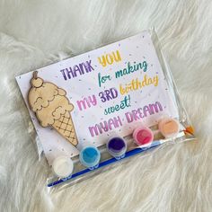 an ice cream themed birthday card with markers and paints on a white furnishing