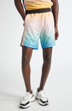 The Parisian label continues to draw inspiration from traditional sporting aesthetics with these football-style shorts boasting a colorful gradient design. 5 1/2" inseam; 26" leg opening; 13 1/4" front rise; 17 1/2" back rise (size Medium) Elastic waist 100% polyester Machine wash, dry flat Made in Portugal Designer Clothing Color Block Sports Bottoms, Short Length, Color Block Athleisure Shorts, Multicolor Moisture-wicking Short Bottoms, Multicolor Sporty Shorts With Moisture-wicking, Multicolor Sporty Moisture-wicking Shorts, Sporty Multicolor Bottoms With Built-in Shorts, Sporty Multicolor Athletic Shorts With Built-in Shorts, Sporty Multicolor Moisture-wicking Shorts, Sporty Multicolor Athletic Shorts