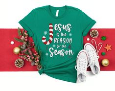 a t - shirt that says santa's favorite ho on it next to christmas decorations