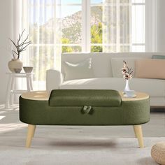 a living room scene with focus on the footstool and window in the background