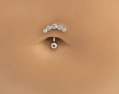 an image of a nose piercing with diamonds on it