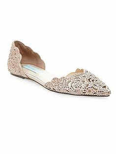 a pair of women's shoes with lace detailing