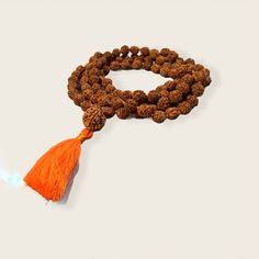 Rudraksha Mala necklace 10mm with 15mm guru bead. Hand Knotted with a cotton tassel. Hindu mala for meditation or chanting. Spiritual Necklaces With 8mm Beads For Rituals, Holistic Hand-strung Mala For Meditation, Holistic Necklaces With 8mm Beads For Rituals, Adjustable Holistic Mala For Meditation, Adjustable Spiritual Mala For Puja, Spiritual Mala With 8mm Beads For Rituals, Bohemian Adjustable Mala For Puja, Spiritual Beaded Necklaces For Meditation And Festivals, Holistic Mala For Meditation Festivals