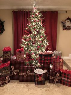 a christmas tree with presents under it