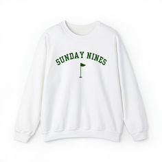 There's nothing better than 9 holes on Sunday! Sport this pullover for your next weekend round. White and green design. Ideal for any situation, a unisex heavy blend crewneck sweatshirt is pure comfort. These garments are made from polyester and cotton. This combination helps designs come out looking fresh and beautiful. The collar is ribbed knit, so it retains its shape even after washing. There are no itchy side seams on these sweaters.  .: 50% cotton, 50% polyester .: Medium-heavy fabric (8.0 oz/yd² (271.25 g/m .: Loose fit .: Sewn-in label .: Runs true to size Golf Inspiration, Golf Brands