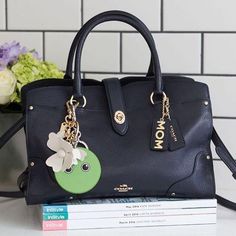 COACH Frisky Emoji Bag Charm - PitaPats.com Black Bag With Key Clip As Gift, Black Novelty Bag For Everyday Use, Everyday Black Bag With Key Clip, Black Bag With Key Clip For Everyday Use, Black Bags With Key Clip For Everyday Use, Green Bag With Keychain For Everyday Use, Black Rectangular Bag With Key Leash, Green Everyday Bags With Keychain, Emoji Bag