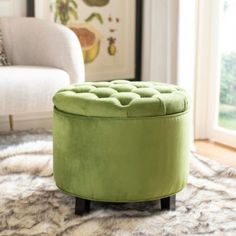 a green ottoman sitting on top of a rug