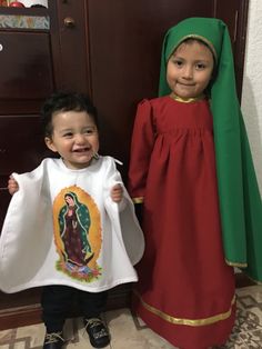 two children dressed in costumes standing next to each other