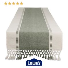 a table runner with tassels on it and five stars in the background that read, louis's