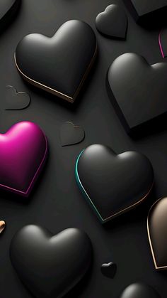 many hearts are arranged in the shape of different shapes and sizes on a black surface