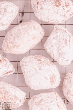 several loaves of bread sitting on top of a wire rack