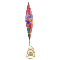 a multicolored metal object with spiral wire on it's side and a white background