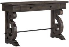 a wooden table with two drawers on one side and an iron bar at the bottom