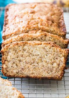 sliced banana bread sitting on top of a cooling rack