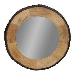 a round wooden mirror hanging on the wall