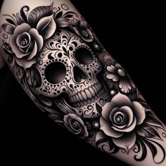 a woman's arm with a skull and roses tattoo on it