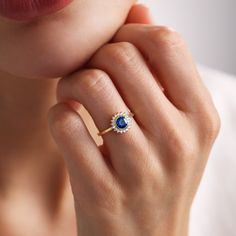 Your Sapphire Engagement Ring is stylish, dainty and pretty ideal for everyday use. Details of solid gold handmade Round Sapphire Ring are very eye-catching. It is a great gift for your loved ones. This jewelry will be an indispensable piece of yours. This meaningful Dainty Birthstone Sapphire Ring with high quality handwork will be a legacy you can leave to your family its.  * Cz Diamond Sapphire Ring Details * Material / Gold Kt:  14K (585), 18K (750), 8K (333) * Available Gold Colors: Yellow Round Sapphire Ring, Sapphire Halo Engagement Ring, Personalized Promise Rings, Sapphire Engagement Ring Halo, Rose Gold Top, Diamond Sapphire Ring, Saphir Ring, Round Sapphire, Promise Ring Gift