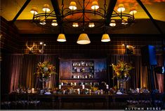 the dining room is decorated with candles and flowers