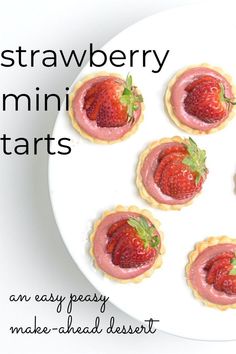 strawberry mini tarts are arranged on a white plate