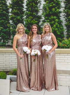 three bridesmaids in sequin dresses posing for the camera