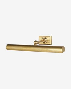 an antique brass door handle on a white background