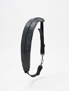 A luxury leather update of the zippered ADDA shoulder strap, this piece can be worn on its own, either as a minimal crossbody bag or around the waist. Using the matt metal carabiner clips on the black webbing straps, the ADDA can be attached to other côte&ciel products as an additional accessory, functioning as a carrying strap or extra storage compartment on bags. Modern Adjustable Bag Strap, Modern Shoulder Strap With Detachable Feature For Everyday Use, Modern Crossbody Shoulder Strap For Everyday Use, Modern Everyday Bag With Detachable Shoulder Strap, Modern Black Bag Strap For Everyday, Modern Detachable Shoulder Strap For Travel, Black Leather Crossbody Bag Strap, Modern Shoulder Bag With Removable Belt, Black Leather Shoulder Strap For Travel