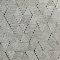 a close up view of a wall made out of wood planks and concrete blocks