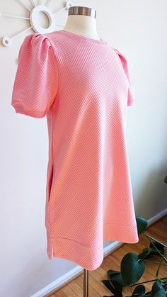 The comfiest and most versatile dress in the sweetest baby pink! It will be your go-to dress this spring and summer because it's so easy to style up or down... Perfect for a special occasion with a pair of sandals, or just running around town in a pair of sneaks. Oh and the best part? It has pockets! Fits true to size Unlined and lightweight Puff sleeves Textured fabric Side pockets Vented hemline Ribbed cuffs Bust: Small 38in, Medium 40in, Large 42in Length (from shoulder): Small 33in, Medium 34in, Large 34in Fabric: 97% polyester; 3% spandex Washing Instructions: Gentle wash cold, line dry Classroom Style, Textured Dress, Just Run, Spring Tops, Versatile Dresses, Dress Jewelry, Peasant Tops, Textured Fabric, New Arrival Dress