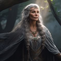 an older woman with grey hair and long white hair wearing a gray dress in the woods