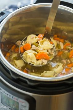 a ladle full of chicken noodle soup in an instant pot