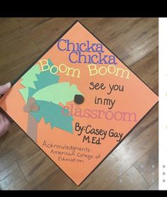 a child's graduation cap with the words chicka chicka boom on it