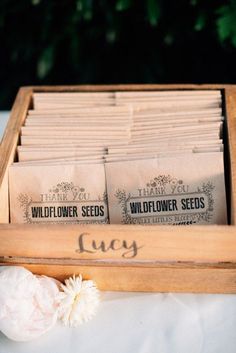 a wooden box filled with lots of seed packets