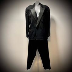 "Vintage 1960s Tuxedo Black virgin wool Double breasted blazer Collar matte finish Silk satin lined with 1 inner breast pocket Pants with proper front pleat No lining Thin double herringbone ribbon band down leg Custom made by John le Careé for a Canadian diplomat stationed in Paris, France during the late 1960s Impeccably crafted Understated elegance Had only one female mannequin for pics... Looks fab and shows how versatile & wonderfully gender neutral tuxedos are.   Marlene Dietrich natch! Timeless beauty Always in style xoxo In excellent condition.  Mint.  Very well crafted. Worn once in Paris by Canadian dignitary at event in 1960s. Dry cleaned and like new. Happy to answer extra inquiries.    Measurements (all measured flat) Blazer Chest:  46\" Length:  29\" Sleeve Length:  24\" Pant Double Herringbone, Blazer Collar, Female Mannequin, Tuxedo Black, Tin Roof, Late 1960s, Marlene Dietrich, Cuffed Pants, Tuxedos