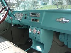 the interior of an old car with blue paint