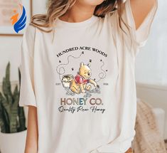 The Vintage Hundred Acre Woods shirt takes you on a nostalgia-filled journey back to the enchanting world of Winnie the Disney Cricut Shirts Winnie The Pooh, Retro Winnie The Pooh, Classic Pooh Bear, Classic Pooh, Hundred Acre Woods, Hawaiian Shirt Women, Comfort Colors Shirt, Pooh Bear, Home T Shirts