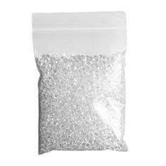 a bag of white plastic beads on a white background