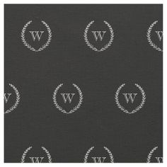 black and white monogrammed wallpaper with the letter w in wreaths on it