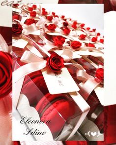 red roses are in a clear box with white ribbon and tags on the top, along with cards that say eleona aluna