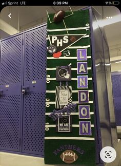 a locker with footballs and other sports related items hanging from it's sides