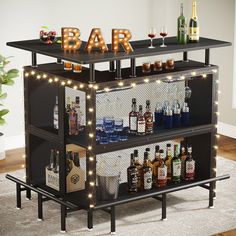 a bar with liquor bottles and lights on the top shelf in front of a rug