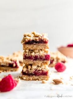 raspberry oatmeal bars stacked on top of each other