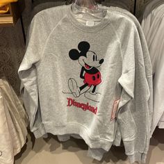 Brand New Pullover Sweatshirt Classic Mickey Screen Art For Vintage Styling Classic Disneyland Logo Soft Knit Fabric Long Raglan Sleeves Ribbed Crew Neck, Cuffs And Hem Enhanced Stitching Fleece Fabrication Interior Part Of The Standing Mickey Mouse Collection For The Whole Family The Bare Necessities 50% Cotton / 50% Acrylic Imported Disneyland Sweater, Disneyland Logo, Mickey Mouse Classic, Disneyland Mickey Mouse, Lilo And Stitch Ohana, Mickey Mouse Outfit, Disney Sweatshirt, Short Faux Fur Jacket, Classic Mickey Mouse