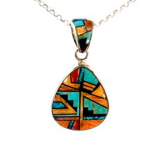 Vintage Southwestern Sterling Silver Inlay Pendant: This inlay pendant features a combination of Turquoise, Black Onyx and Spiny Oyster, beautifully handcrafted with expert attention to detail. Immerse yourself in true Southwestern style with this exceptional addition to any collection. Stones: Turquoise, Onyx, Spiny Oyster, Lapis Setting: 1".25 L x 1"W (bottom) Size: 2" L w/bail (a tad under 2") Metal: Sterling Silver Weight: 12.9 Grams Includes 16" SS Rolo Chain This listing is for (1) Pendant only Explore our curated selection of Vintage Pendants + Necklaces here. Discover the entire 'Silver Raven' Vintage Collection for yourself. Artisan Oval Necklace With Inlay, Artisan Oval Inlay Necklace, Southwestern Style Multicolor Turquoise Pendant Necklace, Multicolor Southwestern Turquoise Pendant Necklace, Southwestern Inlay Necklace For Gift, Southwestern Style Inlay Necklace For Gift, Southwestern Turquoise Inlay Pendant Necklace, Artisan Turquoise Pendant Necklace With Inlay, Artisan Teardrop Inlay Jewelry