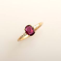 Natural ruby ring made in 14k or 18k yellow gold and set with diamonds on the side. This ring is also suitable for anniversaries, gifts, or any other special occasion. This listing is for YELLOW GOLD. you can order other colors from the following links: ● Rose gold - https://www.etsy.com/listing/1068202701 ● White gold - https://www.etsy.com/listing/1054246238 ♦ CENTER GEMSTONE SPECIFICATIONS ♦ Type: Ruby Shape: Oval Cut Carat Weight: 0.74ct Color: Purplish Red Clarity: VS ♦ SIDE DIAMONDS SPECIF Diamonds Purple, Ruby Ring Designs, Gold Band Engagement Rings, Pink Academia, Gift Wishlist, Heirloom Rings, Natural Ruby Ring, Ruby Rings, Gold Ring Designs