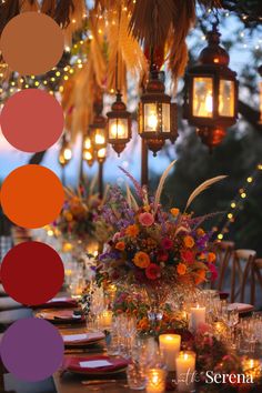 the table is set with candles, plates and vases filled with flowers on it