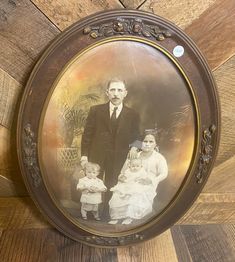 an old photo of a man and two children