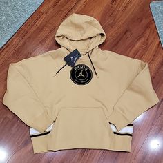 Nwt Size M Jordan Hoodie. It Has Front Pouch Pocket. Style Is Loose Fit. Color Is Light Sandy Or Dessert. Approx Pit To Pit: 26.5" Approx Width Across Bottom Hem : 20" Approx Length From Top Of Front Shoulder (Next To Collar) To Hem : 23.5" Winter Sportswear Yellow Hoodie, Winter Sportswear Hoodie In Yellow, Yellow Hooded Hoodie Athleisure Style, Yellow Winter Sportswear Hoodie, Sporty Yellow Hoodie With Double-lined Hood, Yellow Sports Hoodie, Sporty Yellow Hoodie With Adjustable Hood, Yellow Sportswear Hoodie For Sports, Yellow Sports Hoodie For Winter