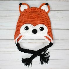 a crocheted hat with a fox face on it