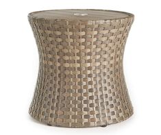 a round wicker side table on white background